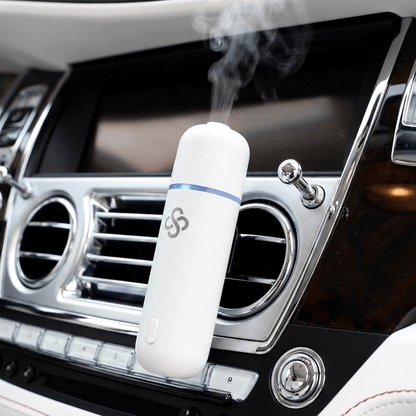 Scent Society White Car Club Diffuser Oil attached to car vent clip emitting diffusing scent