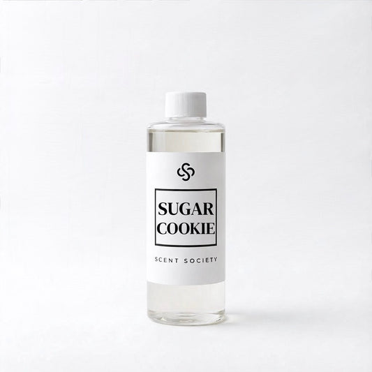 Bottle of 'Sugar Cookie' diffuser oil fragrance by Scent Society on a white background